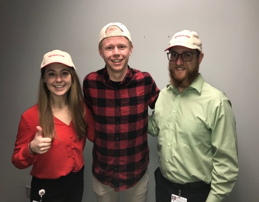 three Marshfield Clinic Research Institute employees standing arm-in-arm