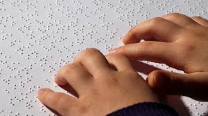 Image of child reading Braille
